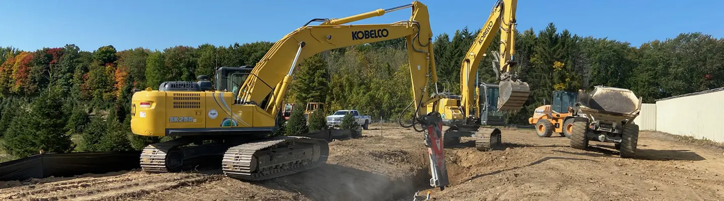 Excavator digging a trench