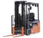 Front view of a gray and orange electric warehouse forklift with black lifting mast and orange forks with an open cabin.