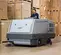 Gray Nilfisk ride-on scrubber