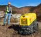 Yellow Wacker-Neuson walk-behind tandem padfoot drum trench compaction roller