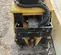 Yellow and black Vibratory Plate Compactor Attachment for Mini Excavator