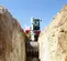 White, red and gray TAKEUCHI 10,000-12,000 lb. Mini Excavator