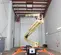 Beige and orange JLG Boom