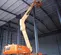 Orange JLG articulating boom lift