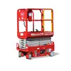 Side view of retracted red Micro19 Mec scissor lift with safety railing.