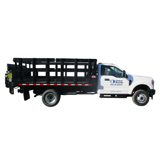 White and black Ford F-550 stake bed truck